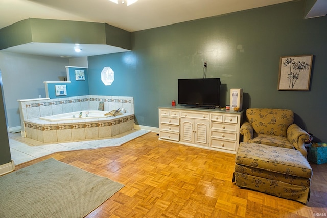 interior space featuring tiled bath and parquet floors