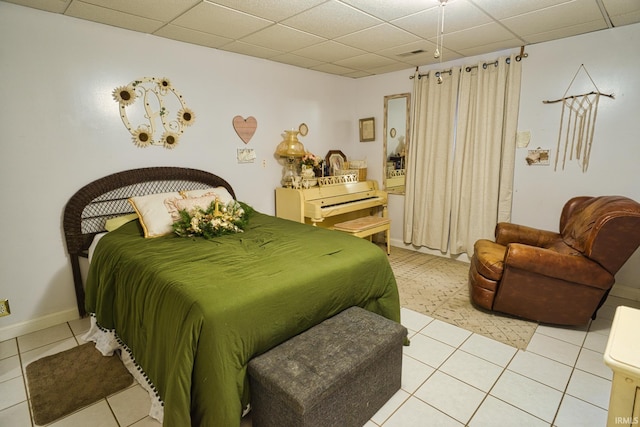 tiled bedroom with a drop ceiling