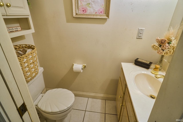 bathroom with tile patterned floors, vanity, and toilet