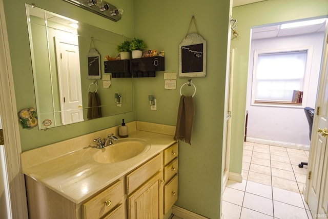 bathroom featuring tile patterned flooring and vanity