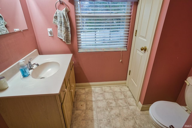 bathroom featuring vanity and toilet