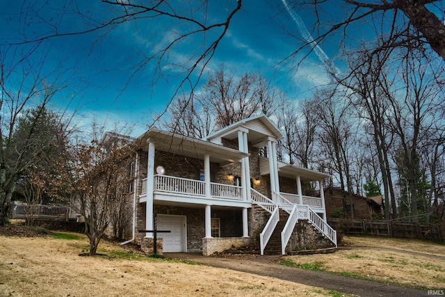 view of front facade featuring covered porch and a garage