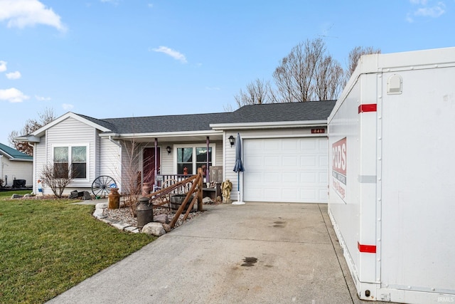 single story home featuring a front lawn and a garage