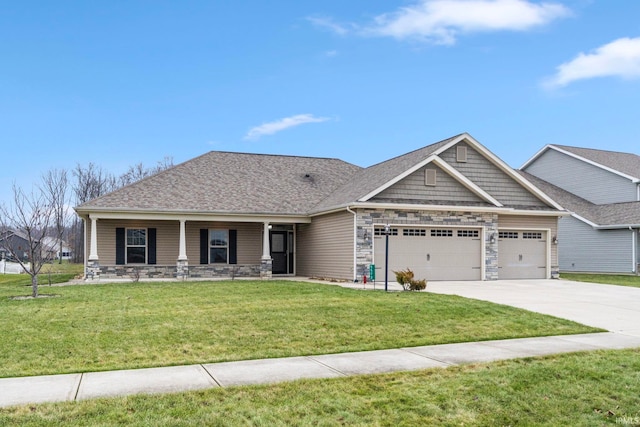 craftsman inspired home featuring a porch, a garage, and a front lawn