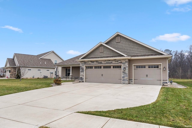 craftsman house featuring a front yard and a garage