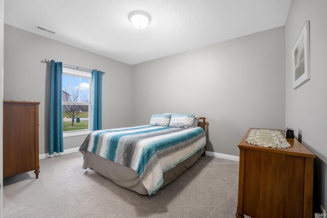 bedroom with light carpet