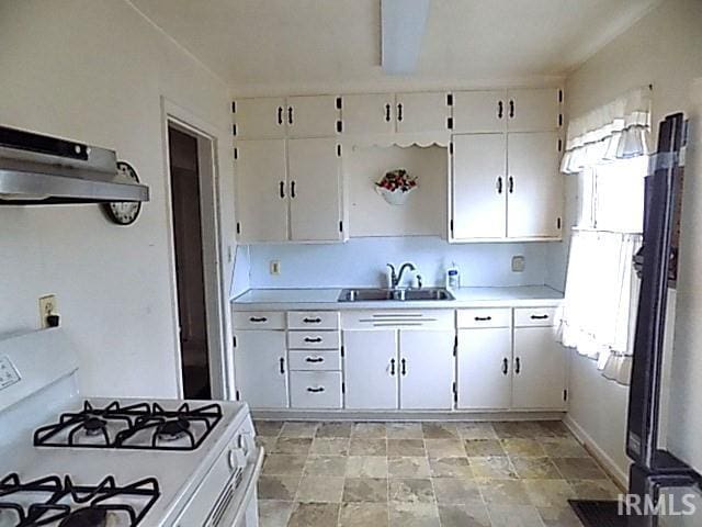 kitchen featuring white cabinets, white range with gas stovetop, and sink