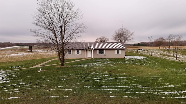 view of front of home with a front yard