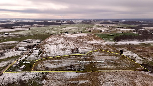 aerial view at dusk featuring a rural view