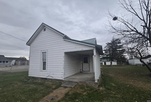 rear view of house with a yard