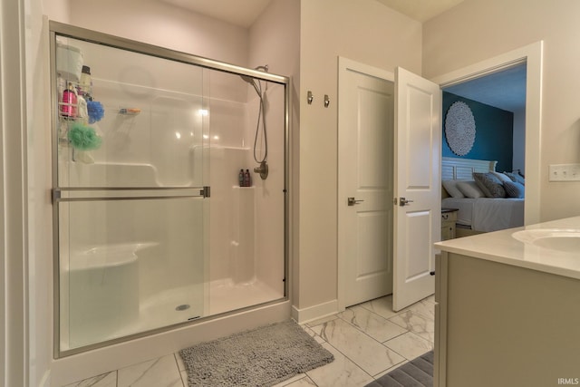 bathroom featuring vanity and an enclosed shower