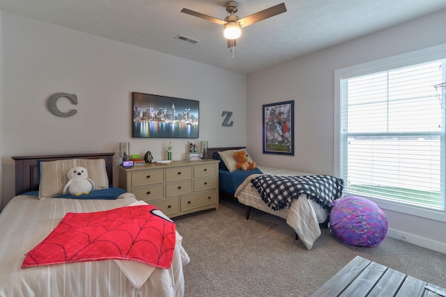 carpeted bedroom with ceiling fan