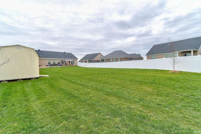 view of yard with a storage shed