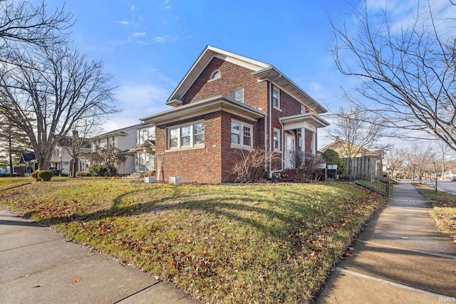 view of side of home featuring a yard