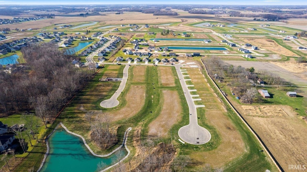 drone / aerial view with a rural view and a water view