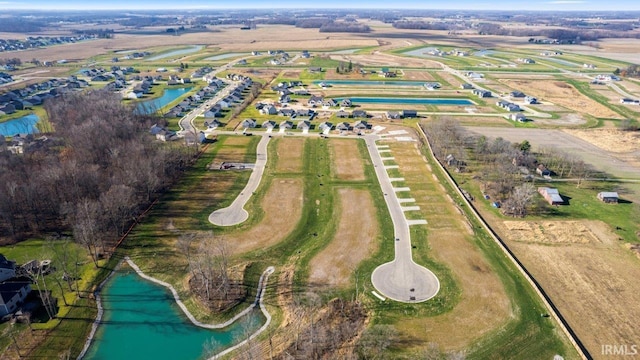 drone / aerial view with a rural view and a water view