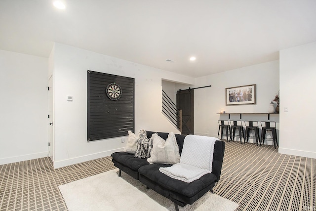 living room featuring a barn door