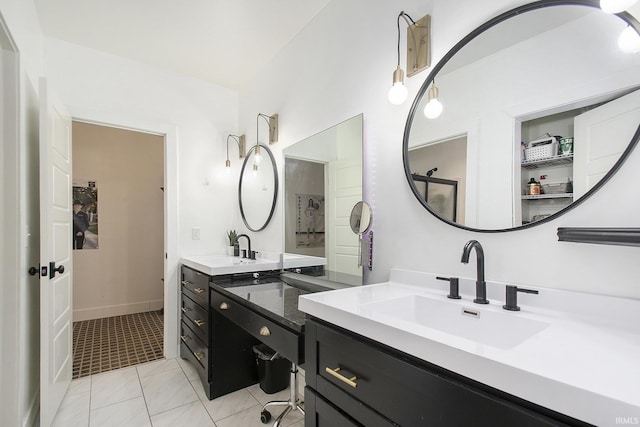 bathroom with tile patterned flooring and vanity