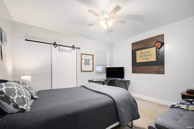 bedroom featuring ceiling fan and light colored carpet