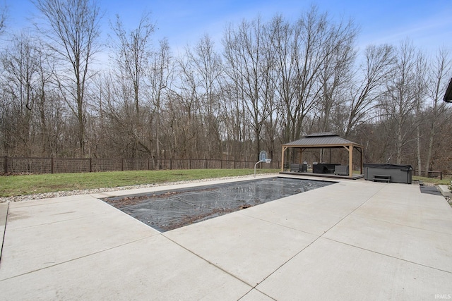 view of pool featuring a gazebo, a patio area, a lawn, and a hot tub