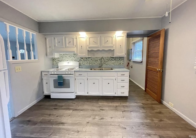 kitchen featuring white cabinetry, sink, tasteful backsplash, dark hardwood / wood-style floors, and white appliances