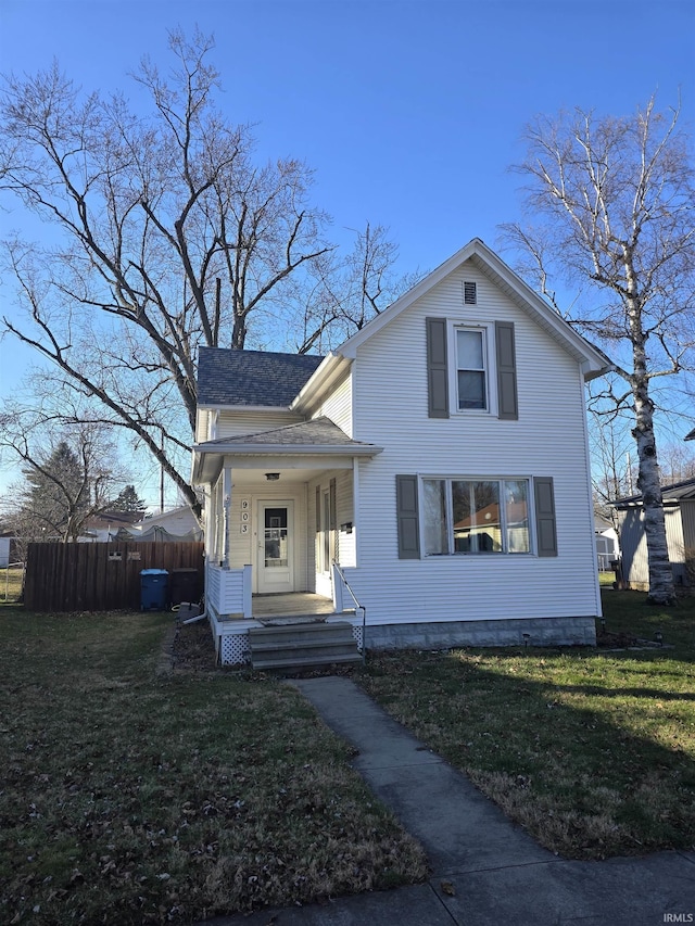 view of front of house featuring a front lawn and covered porch