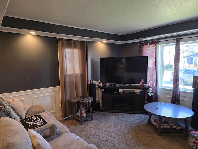 living room with a fireplace, a textured ceiling, and carpet flooring