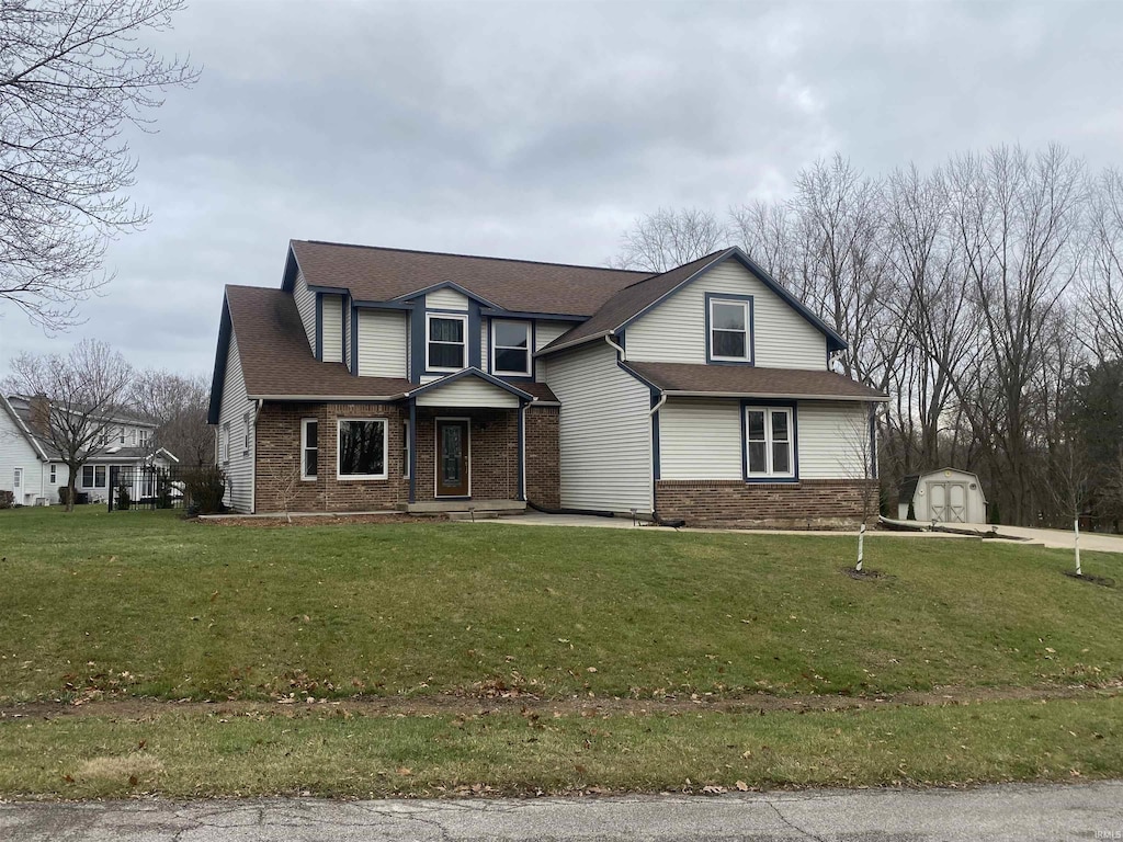 front of property with a storage unit and a front yard