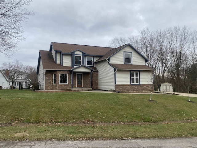 front of property with a storage unit and a front yard