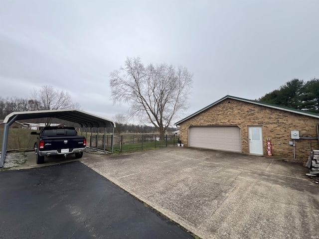 garage featuring a carport