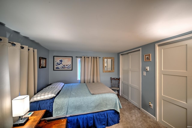 bedroom featuring light carpet