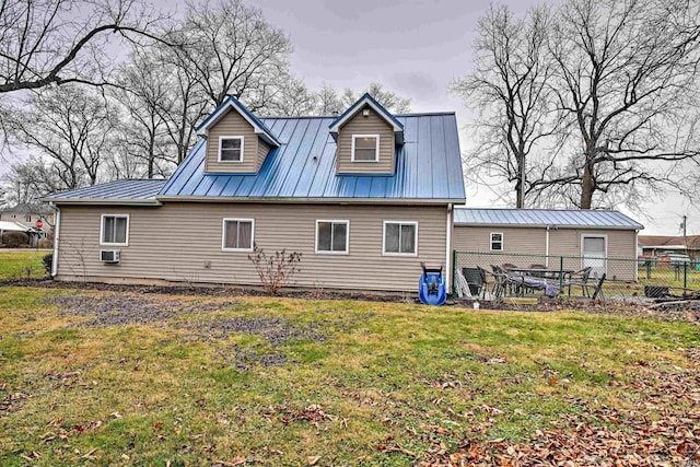 back of house with a yard