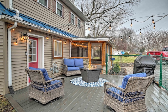 wooden deck with a sunroom