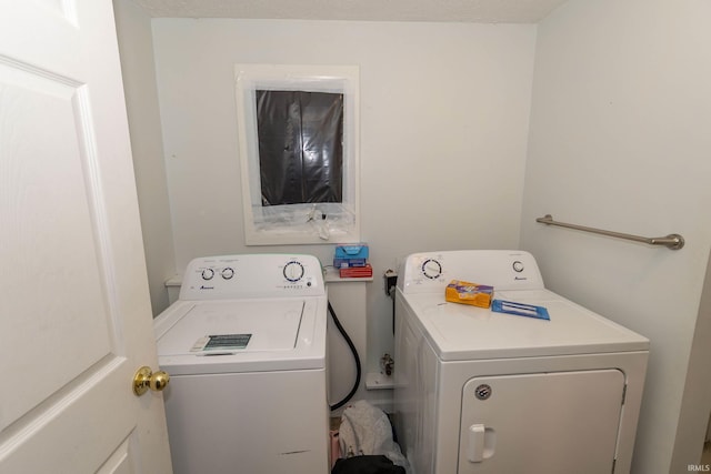 clothes washing area featuring washing machine and clothes dryer