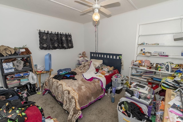 carpeted bedroom featuring ceiling fan and ornamental molding