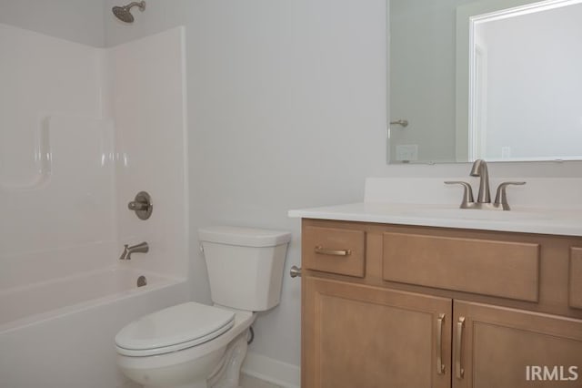 full bathroom featuring toilet, vanity, and washtub / shower combination