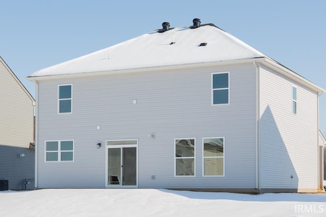 view of snow covered house