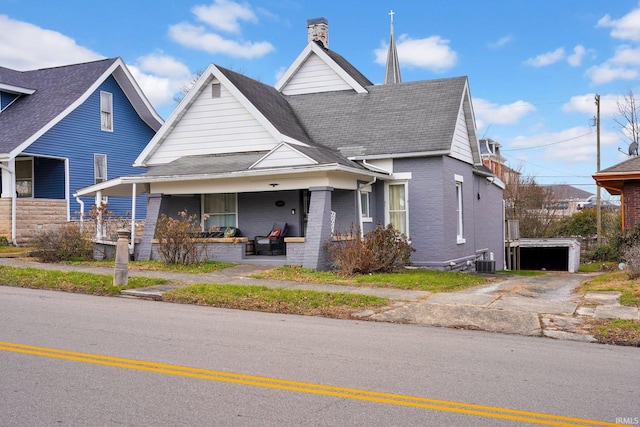 view of front of house featuring covered porch and central AC