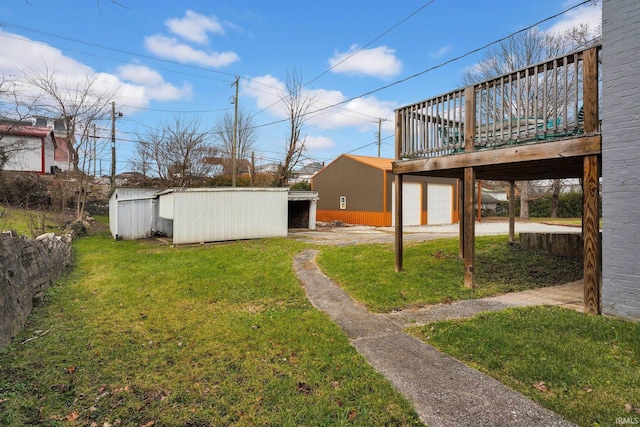 view of yard featuring an outbuilding and a deck