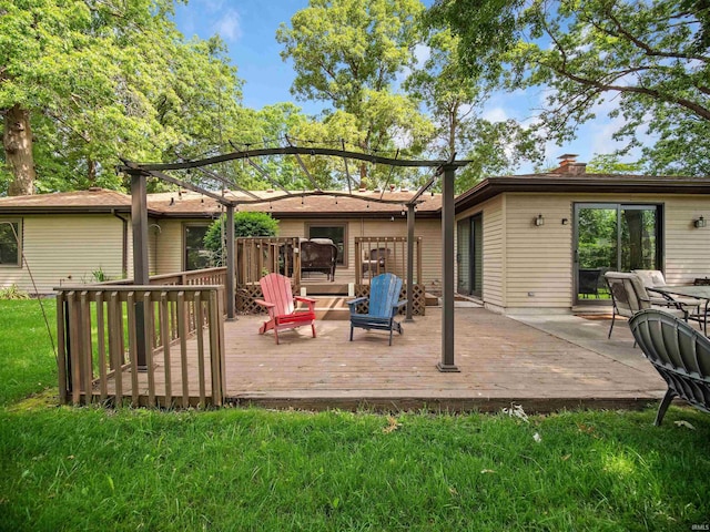 back of house featuring a yard and a wooden deck