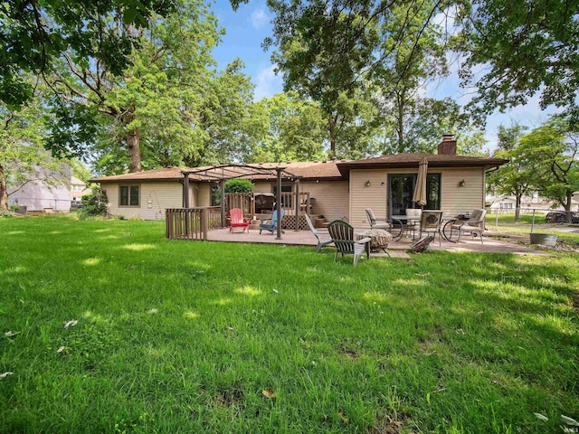 back of house with a lawn, a patio area, and a pergola