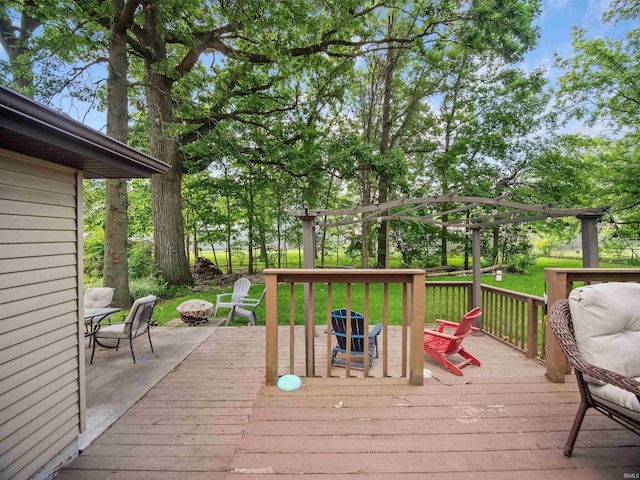 wooden deck featuring a lawn