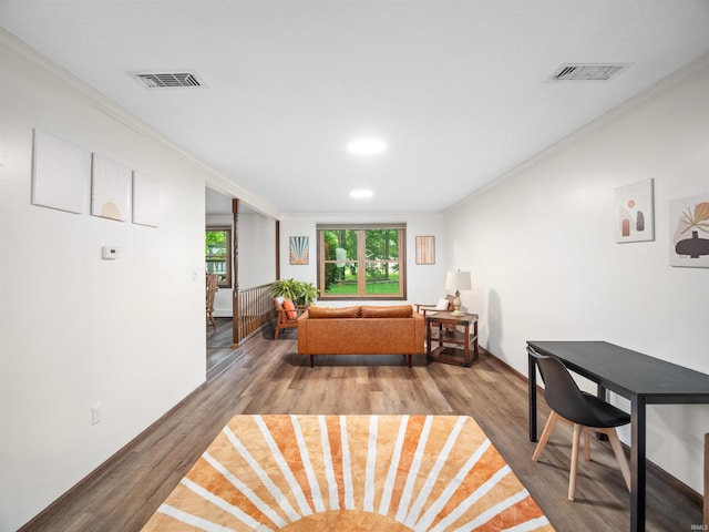 living room featuring crown molding and hardwood / wood-style floors