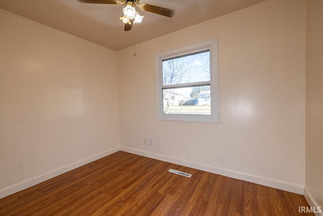 unfurnished room featuring hardwood / wood-style floors and ceiling fan