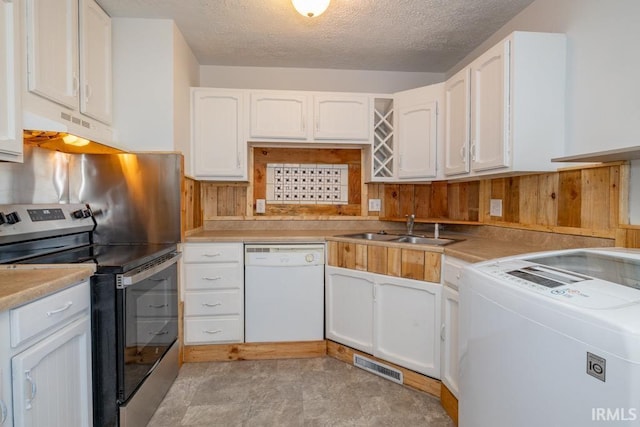 kitchen featuring stainless steel electric stove, white cabinetry, sink, and white dishwasher