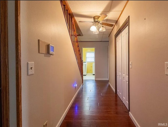 hallway with dark wood-type flooring