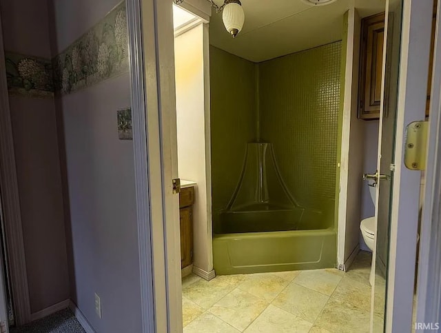 full bathroom featuring tile patterned floors, vanity,  shower combination, and toilet