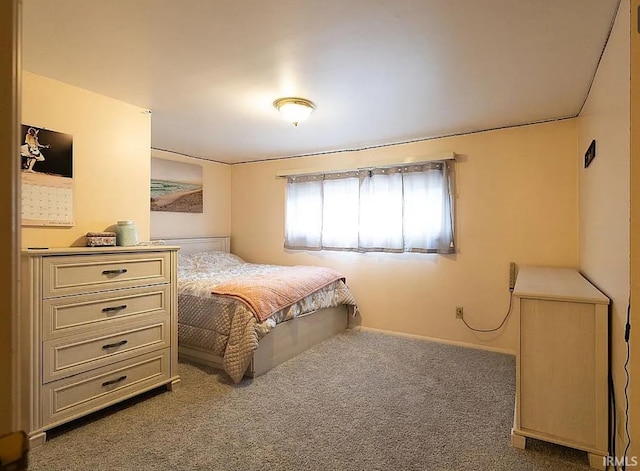 bedroom with dark colored carpet