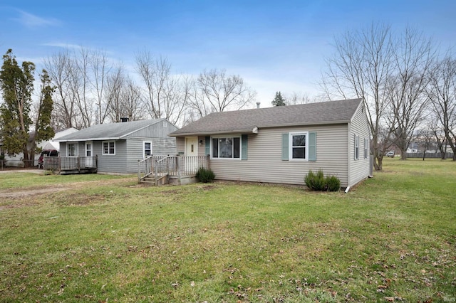 single story home featuring a front lawn