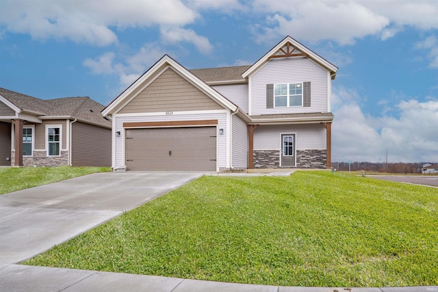 craftsman house with a garage and a front lawn